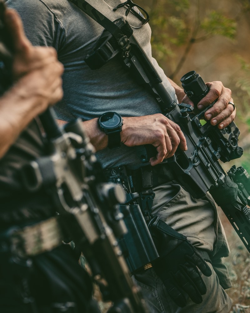 Carbines, gloves, and hands at the ready on the mountain